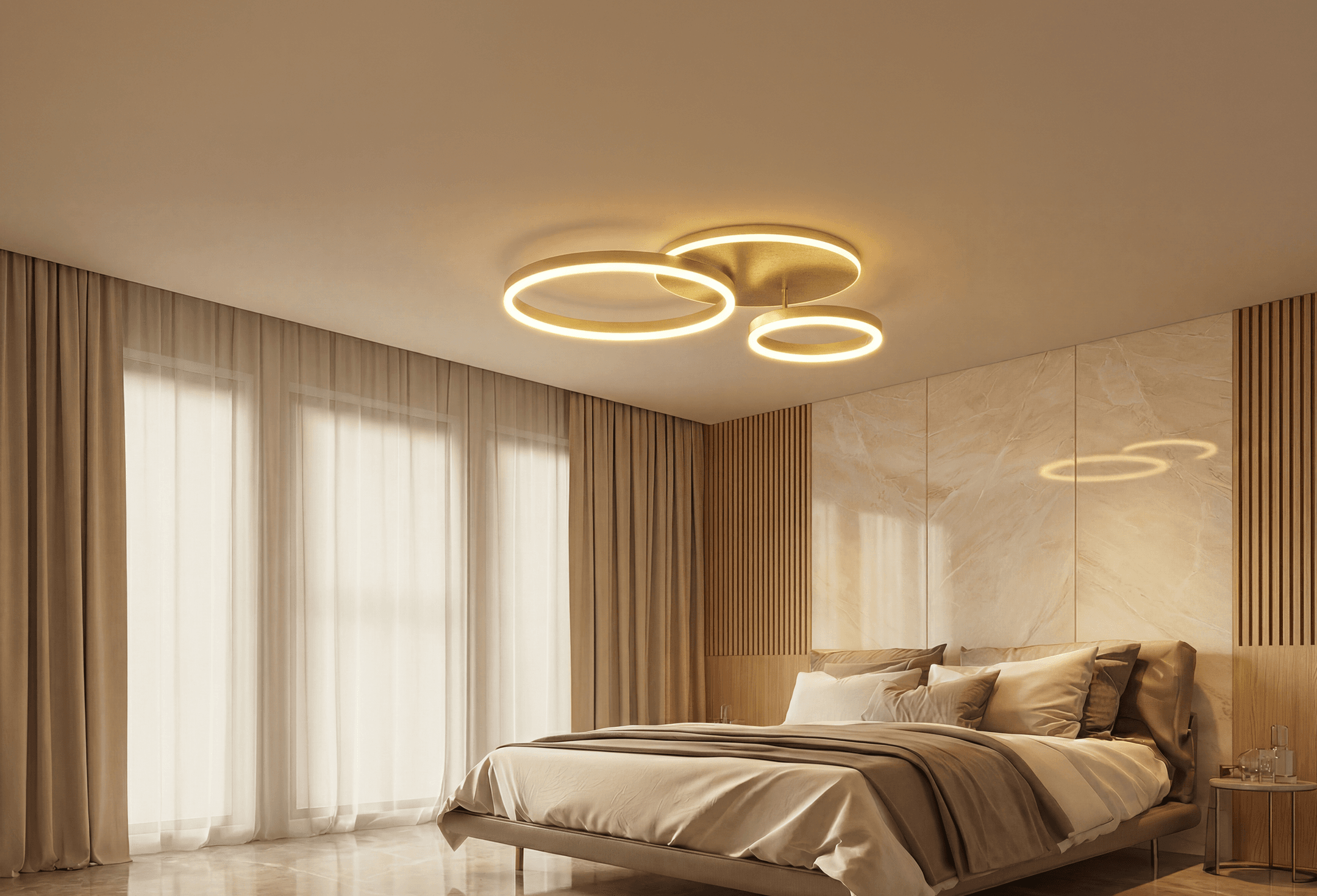 Chloe flush mount ceiling light with overlapping gold rings in a bedroom