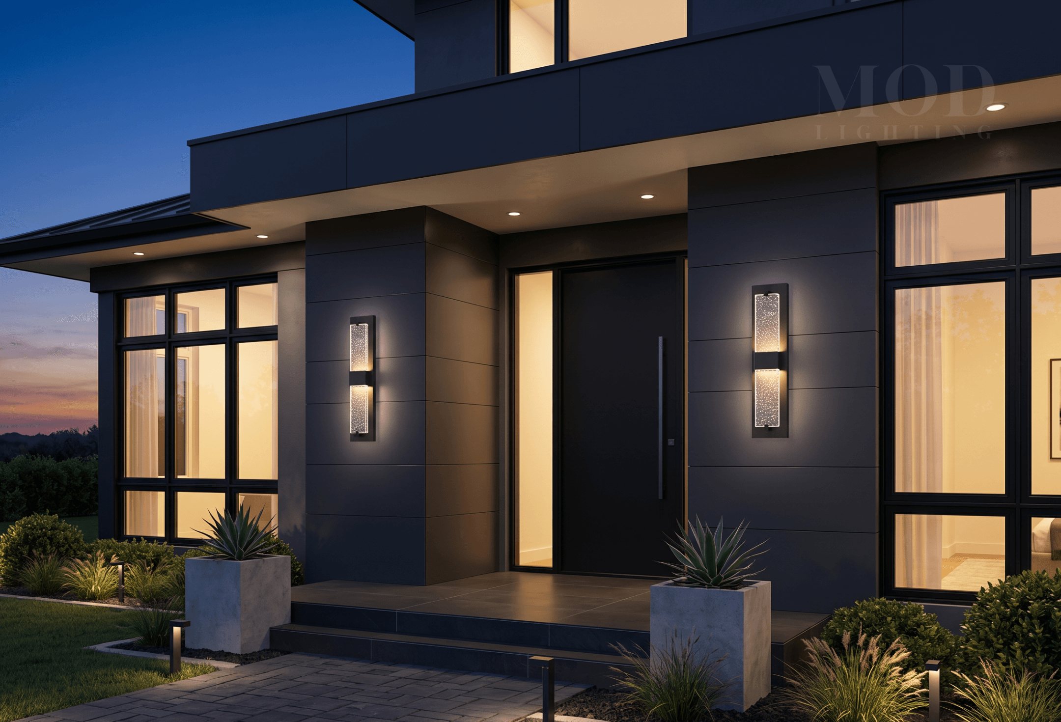 Modern front porch with warm interior and exterior lighting contrast