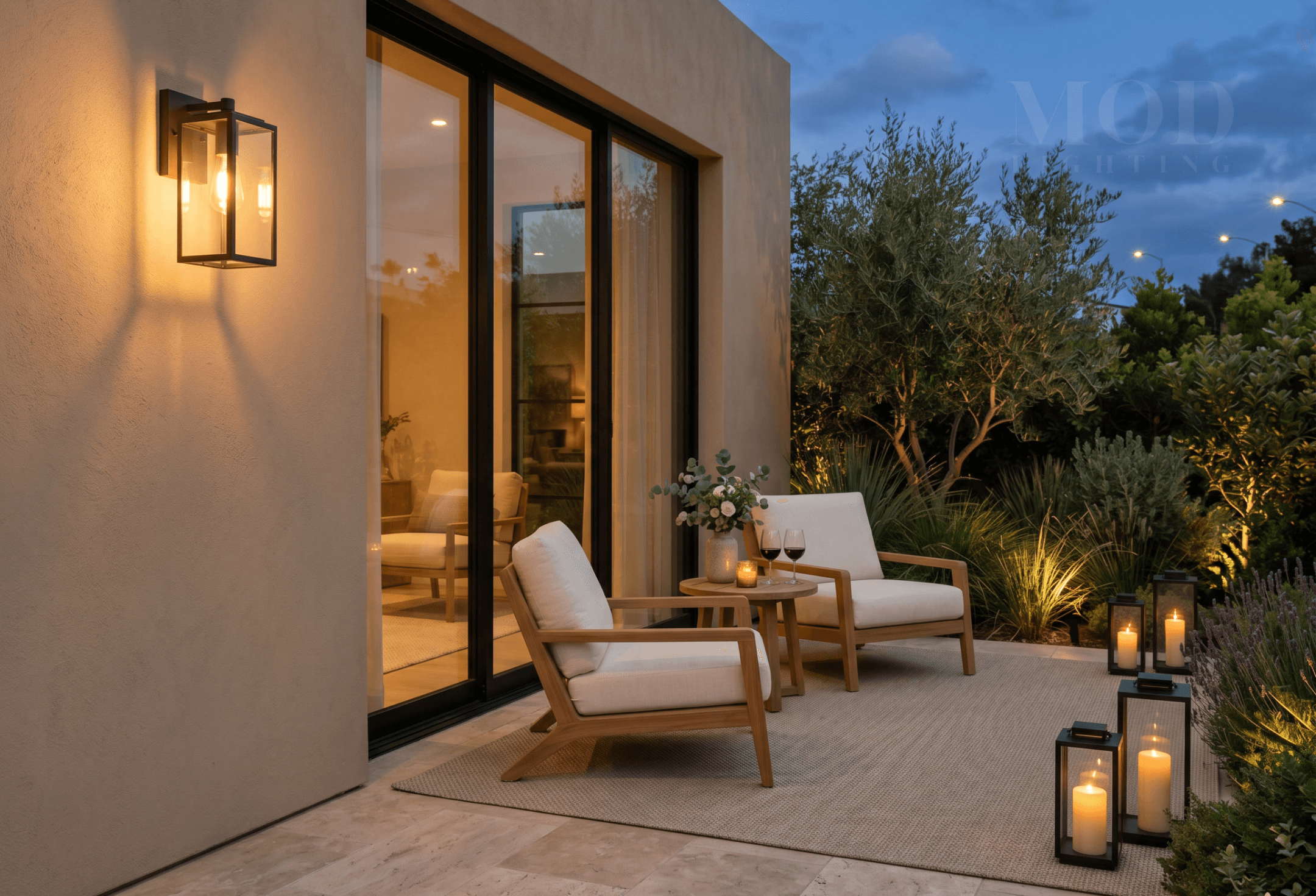 Open outdoor patio at night w path lights and garden uplighters