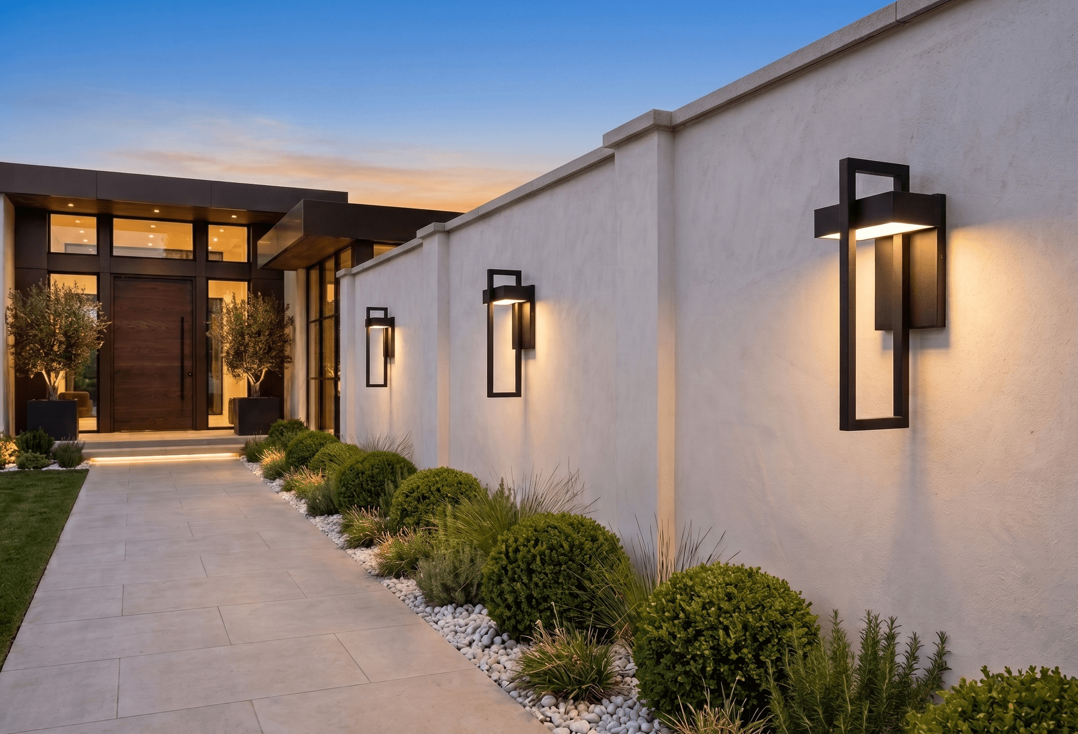 Terri matte-black outdoor lantern sconces mounted on a rendered exterior wall